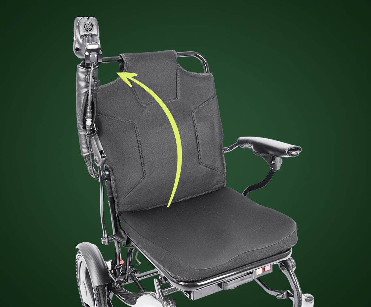 A close-up view of the Harvey Carbon Power Wheelchair focusing on its ergonomic seating system. The image highlights the contoured black mesh backrest designed for lumbar support and the high-density foam seat cushion. The carbon fiber frame transitions smoothly into the padded armrests, illustrating the chair's focus on user comfort and postural alignment.
