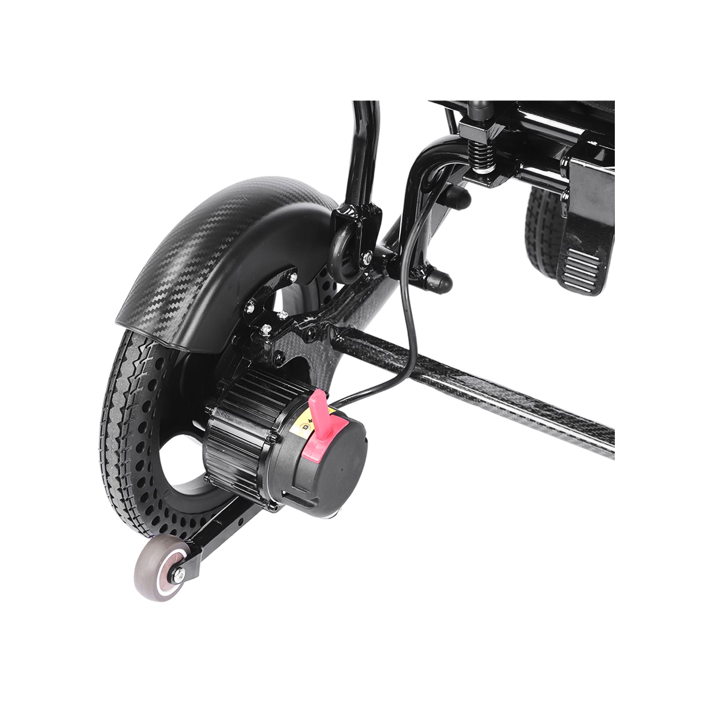 An angled close-up view of the rear motor and drivetrain assembly of the Harvey Carbon Power Wheelchair. It shows a large rear drive wheel with a unique textured-tread pattern, partial carbon fiber fender with a detailed weave, and the compact electric hub motor. A bright red manual freewheel lever is prominent on the motor, and a small anti-tip caster wheel is positioned further rearward.