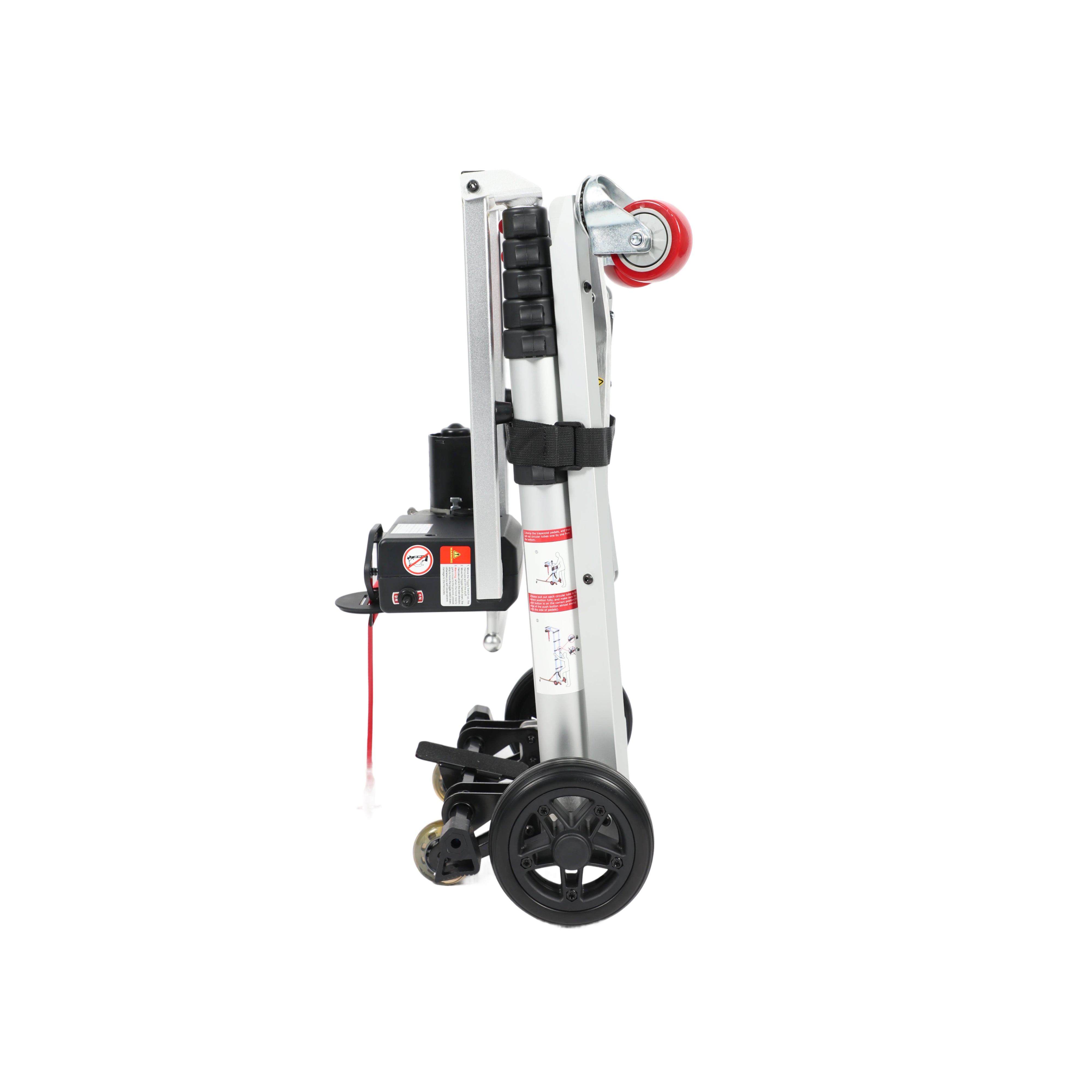 A side view of the Muvon Mobility portable lift, shown in its compact, fully folded position for storage or transport. The lift features a vertical silver aluminum frame with a black motor housing and control box attached to the side. It is equipped with large black rubber wheels at the base for easy movement and a smaller red caster wheel at the top of the folded assembly.
