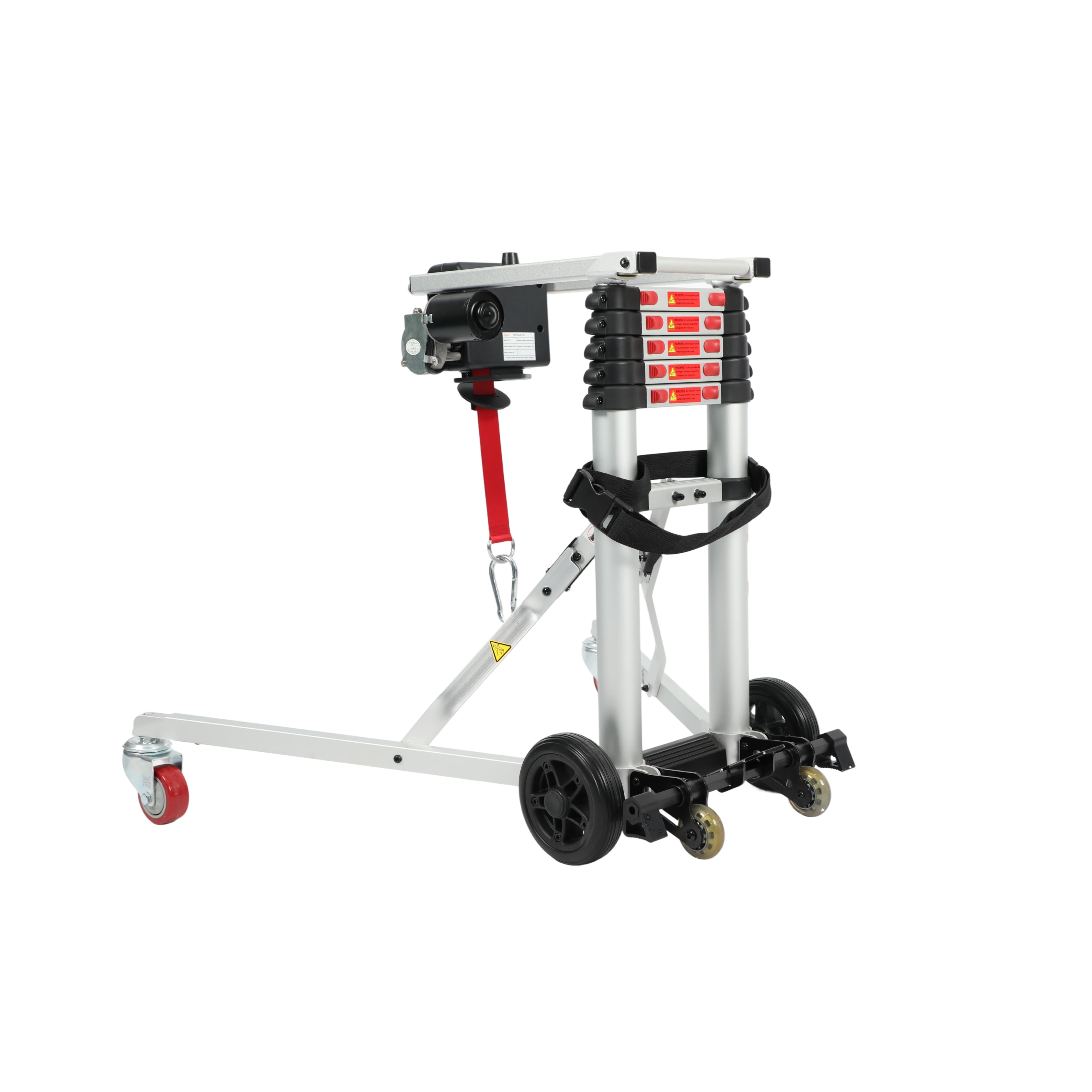 An angled side view of the Muvon Mobility portable lift in its partially unfolded or operational state. The silver aluminum frame is extended into a tripod-like base for stability, supported by large black wheels and a smaller red caster wheel on the extended leg. The telescopic vertical mast features several black adjustment segments with red safety labels. A black motor unit is mounted at the top, from which a red heavy-duty strap with a metal carabiner hook hangs down, ready for lifting.