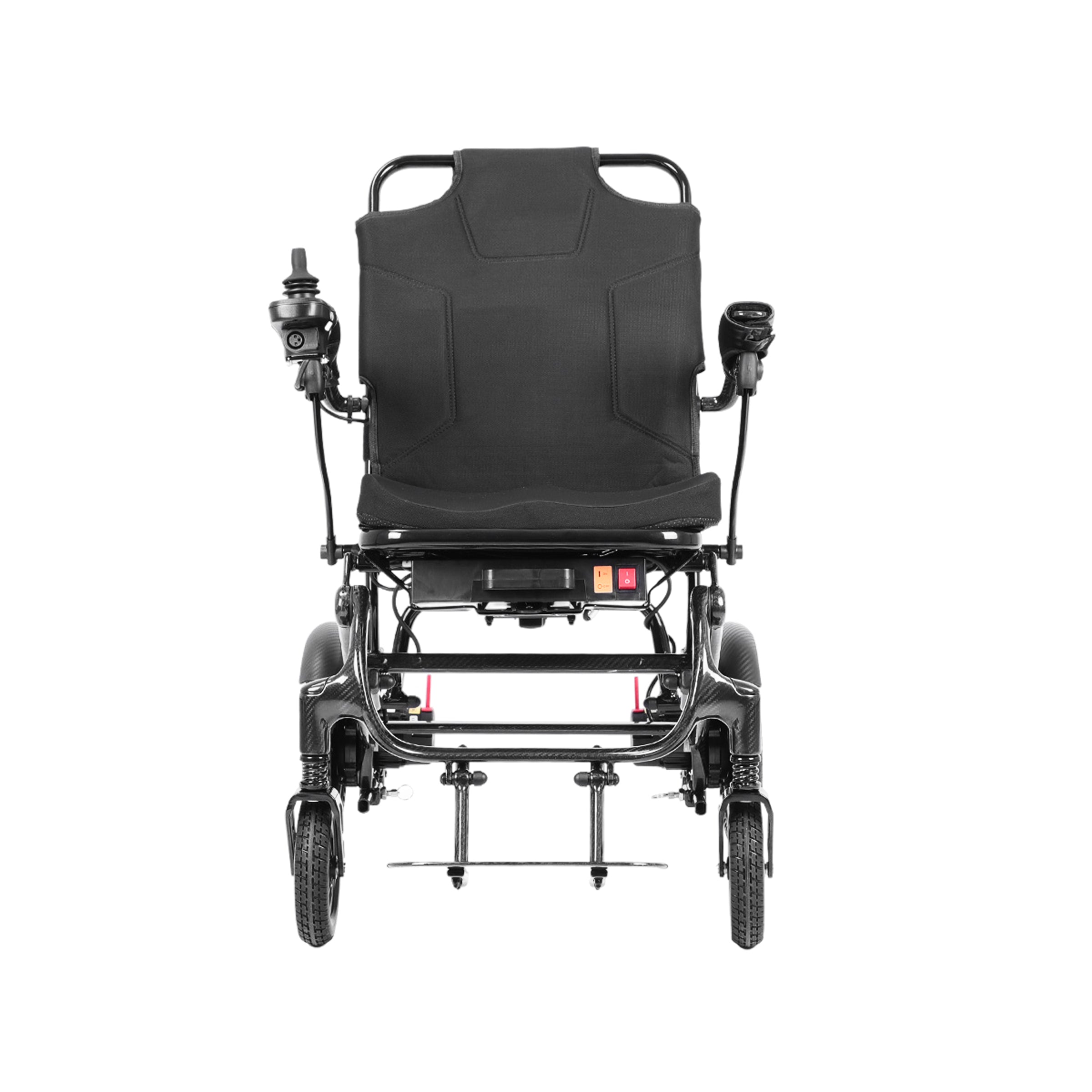 A direct front view of the Harvey Carbon Power Wheelchair. It highlights the wide, padded backrest with ergonomic stitching and the two curved armrests. The joystick controller is mounted on the left armrest. The symmetrical carbon fiber leg rest frame supports a footplate. The central frame-mounted console with the red power switch is clearly seen.