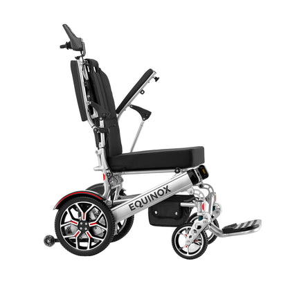 Side profile of the silver frame Muvon Equinox power wheelchair showing the padded armrest flipped completely upward for easy transfers.