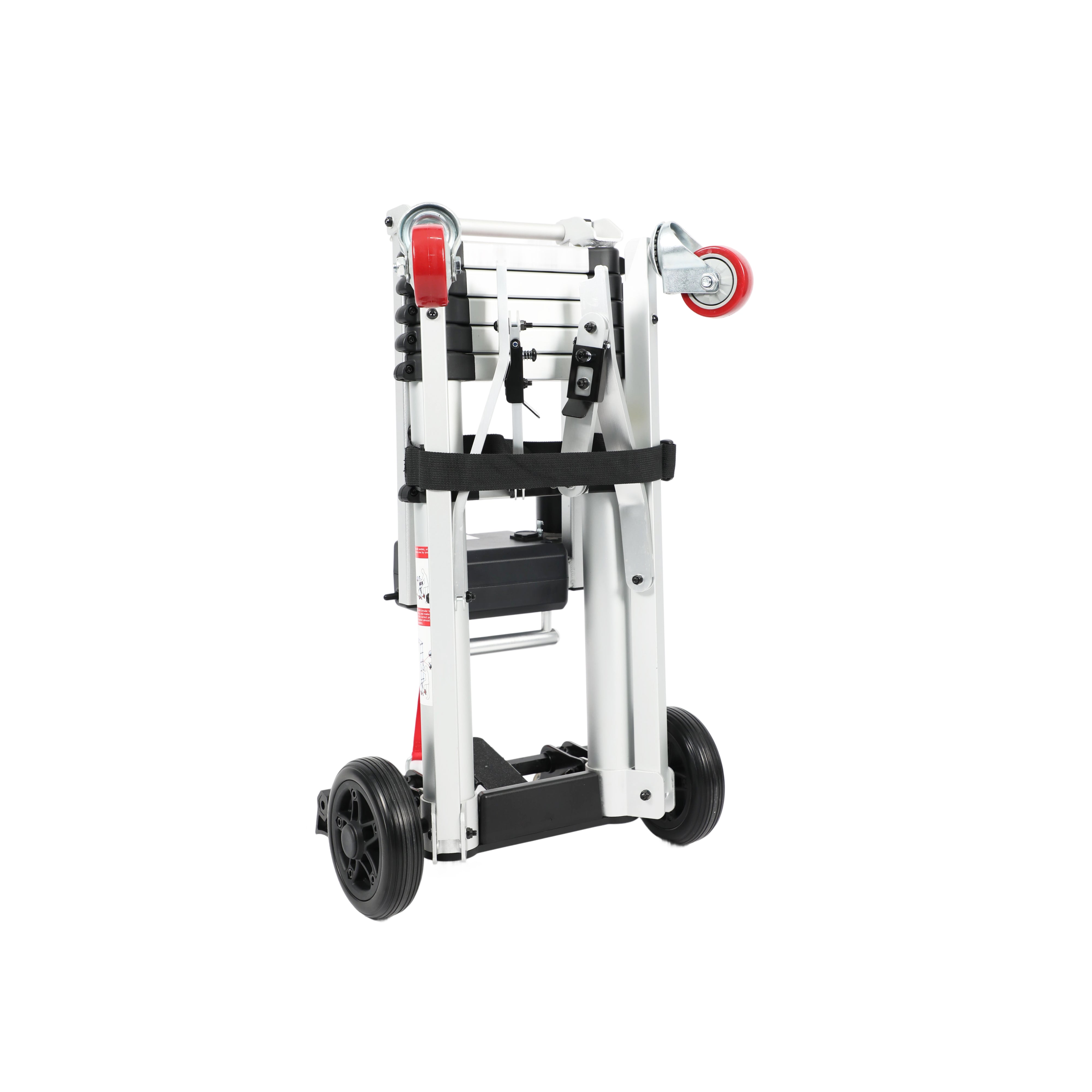 An angled rear-view of the Muvon Mobility portable lift shown in its vertically folded position for transport or storage. The unit features a silver telescopic aluminum frame with two red caster wheels at the top and two large black wheels at the base. An adjustable black buckle strap secures the folded components, and a prominent red strap hangs from the motor assembly.